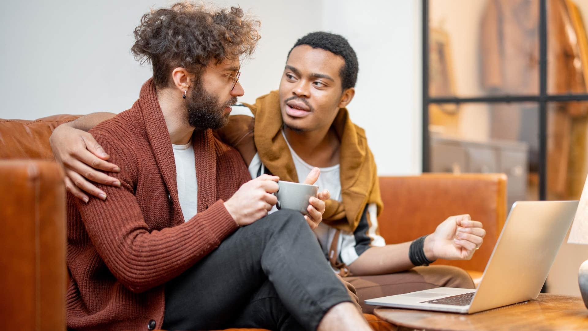 Two colleagues collaborating on a laptop